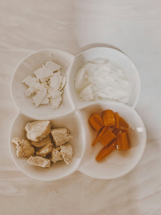 sliced carrots and white cheese on white ceramic plate